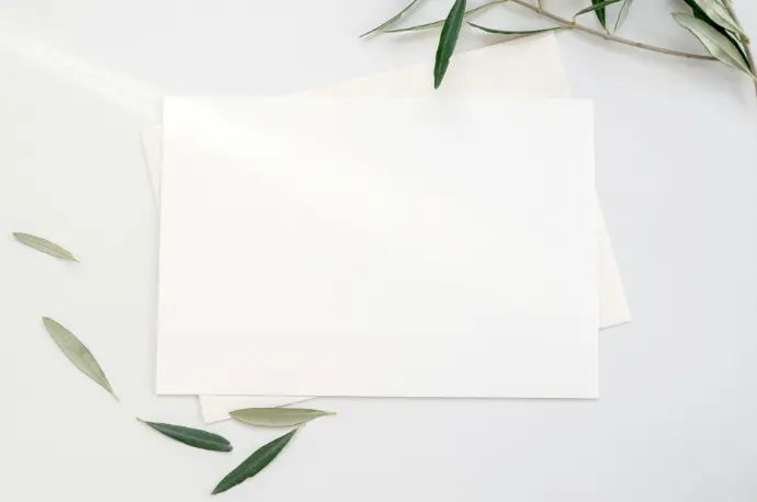 white printer paper with green leaves